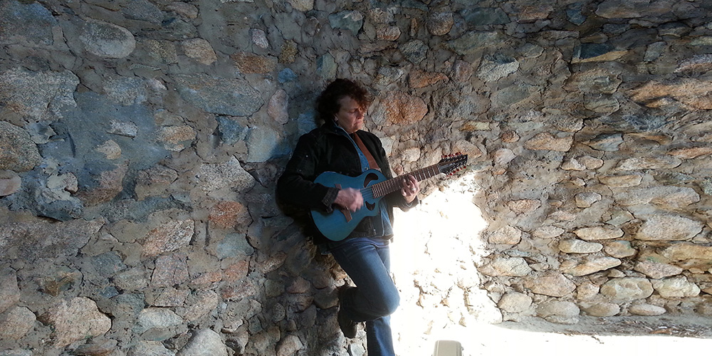 Lorah playing guitar